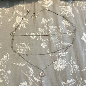 Three tier silver necklace with pink crystal pendant and pink beads
